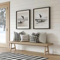 Modern interior featuring coastal artwork and plaid pillows in a serene living space photo