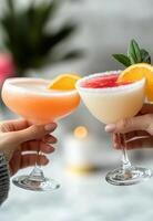 Cheers with colorful cocktails during a sunny afternoon celebration photo