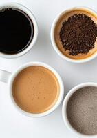 Three cups of coffee with roasted beans on a white background photo