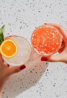 Cheers with colorful cocktails during a sunny afternoon celebration photo