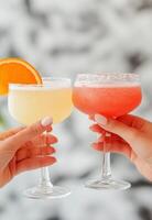 Cheers with colorful cocktails during a sunny afternoon celebration photo