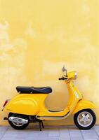 Bright yellow scooter parked against a weathered wall in a charming urban setting photo