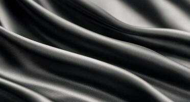 Elegant black satin fabric draping softly in natural light photo