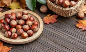 Freshly harvested hazelnuts on a textured wooden table with autumn leaves in the background photo