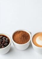 Various coffee beans and ground coffee displayed in bowls on a light background photo