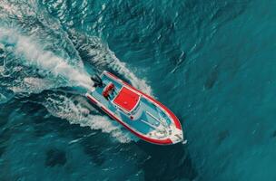 Red Boat Cruising Over Turquoise Waters in a Tropical Paradise photo