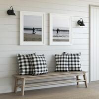 Cozy living area with beach-themed artwork and comfortable seating photo