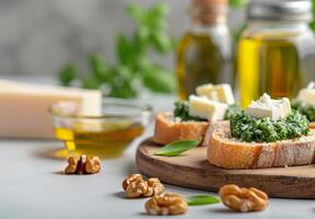 Fresh Spinach and Walnut Crostini With Olive Oil on a Rustic Wooden Board photo