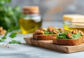 Fresh Spinach and Walnut Crostini With Olive Oil on a Rustic Wooden Board photo
