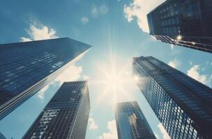 Sunlight Shining Down Between Skyscrapers in Urban Setting photo