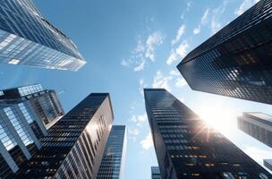 Sunlight Shining Down Between Skyscrapers in Urban Setting photo
