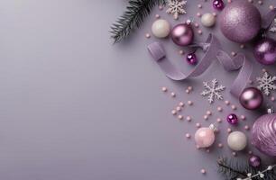 Festive Decorations With Purple Ornaments and Pine Cones on Table photo