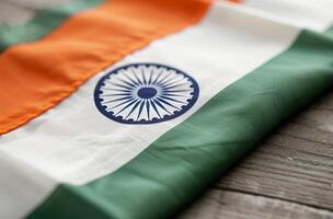 Indian National Flag Draped on a Rustic Wooden Surface photo