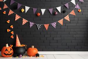 Festive Halloween Decorations With Candy and Pumpkins on Dark Surface photo