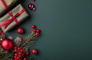 Festive Arrangement of Christmas Decorations and Gifts on Dark Green Background photo
