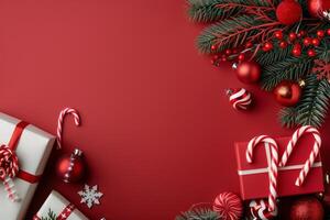 Festive Christmas Decorations With Gifts and Candy Canes on Red Background photo