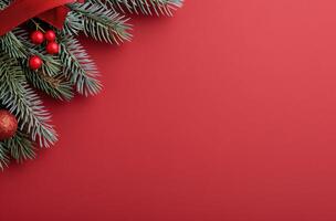 Festive Pine Branches With Red Ornaments and Pine Cones on a Rich Red Background photo