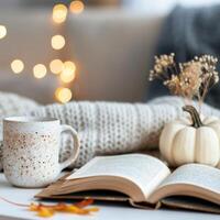 Cozy Autumn Moment With Coffee, Book, and Decorative Elements in a Living Room photo