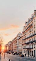 Sunset Over Parisian Street With Classic Architecture in the Evening photo