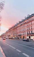 Sunset Over Parisian Street With Classic Architecture in the Evening photo