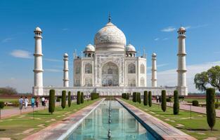 Majestic Taj Mahal at Sunrise Surrounded by Lush Gardens in Agra, India photo