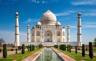 Majestic Taj Mahal at Sunrise Surrounded by Lush Gardens in Agra, India photo