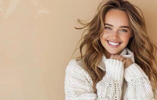 Smiling Woman in Cozy Sweater Against Plain Background photo