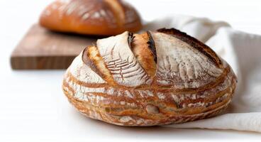 Freshly Baked Artisan Bread on a Wooden Cutting Board in a Light Kitchen photo