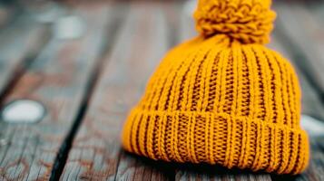 Cozy Knit Yellow Beanie on Wooden Surface in Natural Light photo