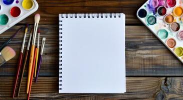 Art Supplies Laid Out on a Wooden Table Ready for Painting in a Creative Space photo