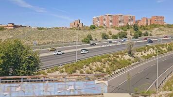 Madrid, Spain 10.08.2024 View from the window of the electric train to the highway and cars. Fast train movement and view through the window of a train traveling from Madrid to Guadalajara. video