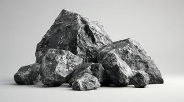 Black Rough Rocks Piled on Light Background photo