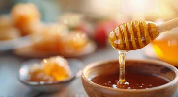 Golden Honey Dripping From Spoon Into Delicate Bowl Amid Soft Background Glow photo
