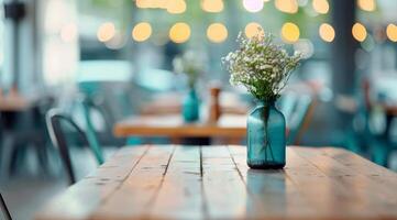 Indoor Plants in Silver and Black Pots on a Wooden Table With Decorative Lights photo