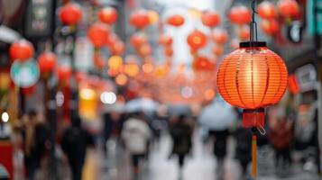 Red Lanterns Illuminating a Busy Street During a Festival Celebration at Night photo