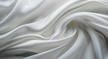 Soft Cream Silk Fabric Draped Elegantly on a Smooth Surface photo