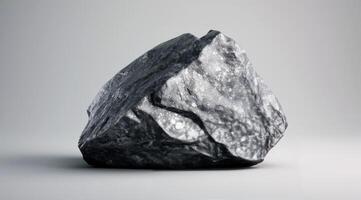 Black Rough Rocks Piled on Light Background photo