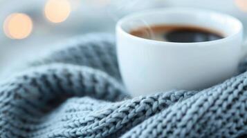 Cozy Coffee Cup Wrapped in Soft Knit Scarf on a Chilly Day photo