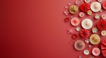 Festive Decorations With Paper Fans and Ornaments on Red Background photo
