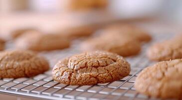 Freshly Baked Cookies Cooling on a Wire Rack in a Warm Kitchen Setting photo