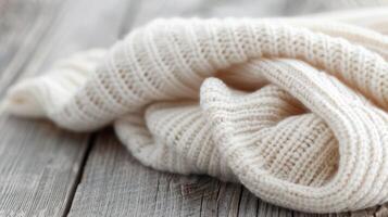 Cozy Knit Sweater With Pinecones on Wooden Surface in Natural Light photo