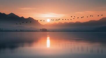 Sunset Over Mountains With Migrating Birds Flying Across Calm Waters photo