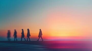Silhouetted Figures Walking Towards Sunset at Urban Crosswalk photo