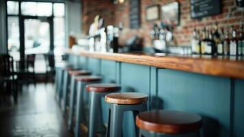Modern Bar Interior With Wooden Stools and Brick Wall in Afternoon Light photo