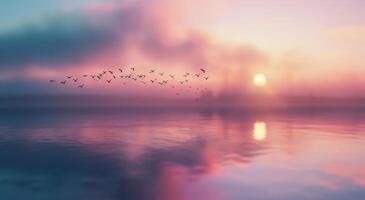 Glowing Sunrise Over Tranquil Lake With Birds in Flight photo