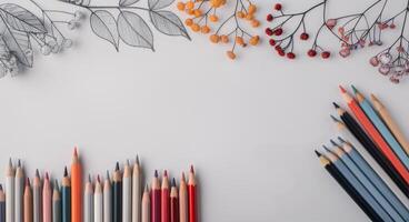 Vibrant Colored Pencils Arranged With Floral Coloring Page on Table photo