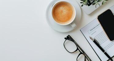 Home Office Workspace With Laptop Coffee Notepad Glasses And Smartphone photo