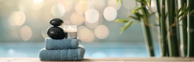 Relaxing Spa Setup With Candles and Stones Beside Soft Towels in a Calm Environment photo