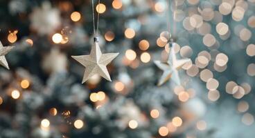 Golden Star Ornaments Glimmering on a Christmas Tree With Blurred Lights photo