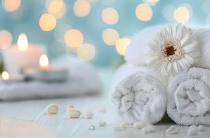 Cozy Spa Setting With Soft White Towels and Flickering Candles at Evening photo
